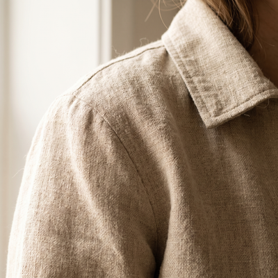 Close view of a linen jacket collar and shoulder