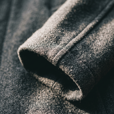Close view of a coat cuff and sleeve seam